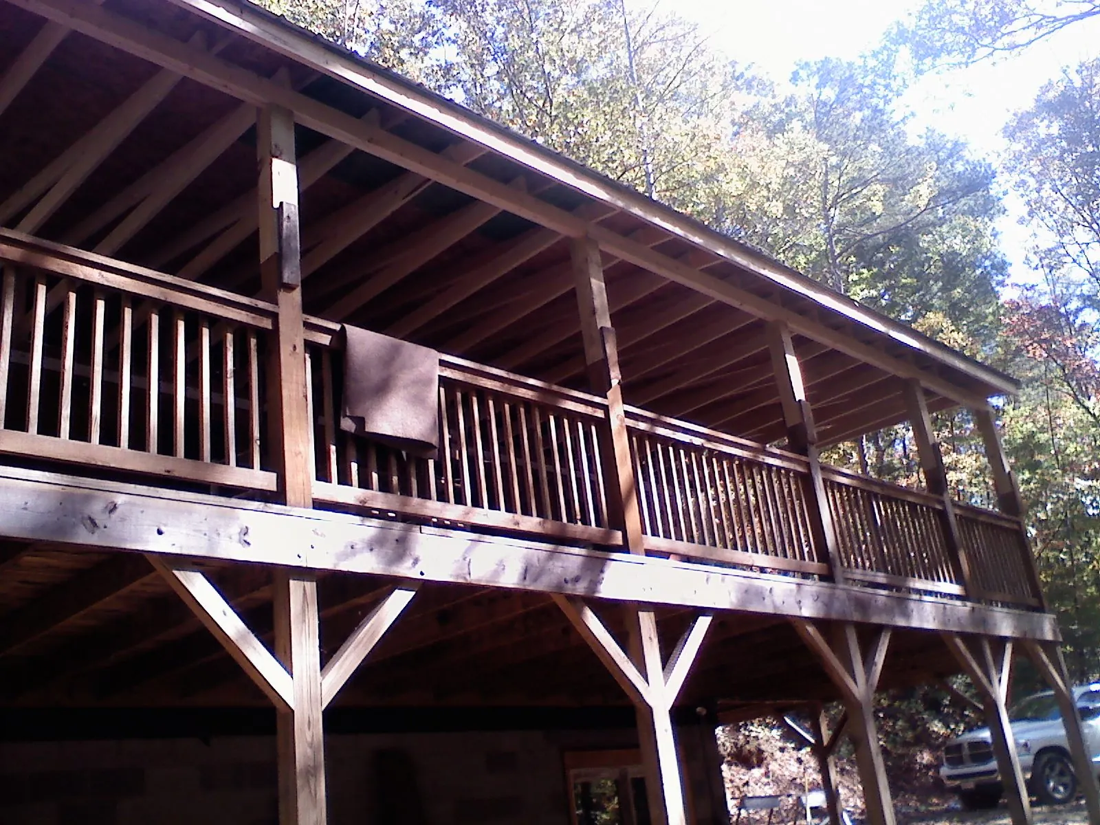 Timber framing under a new elevated porch and deck — Roof Leak Repair in Peterborough by Roofing Brothers